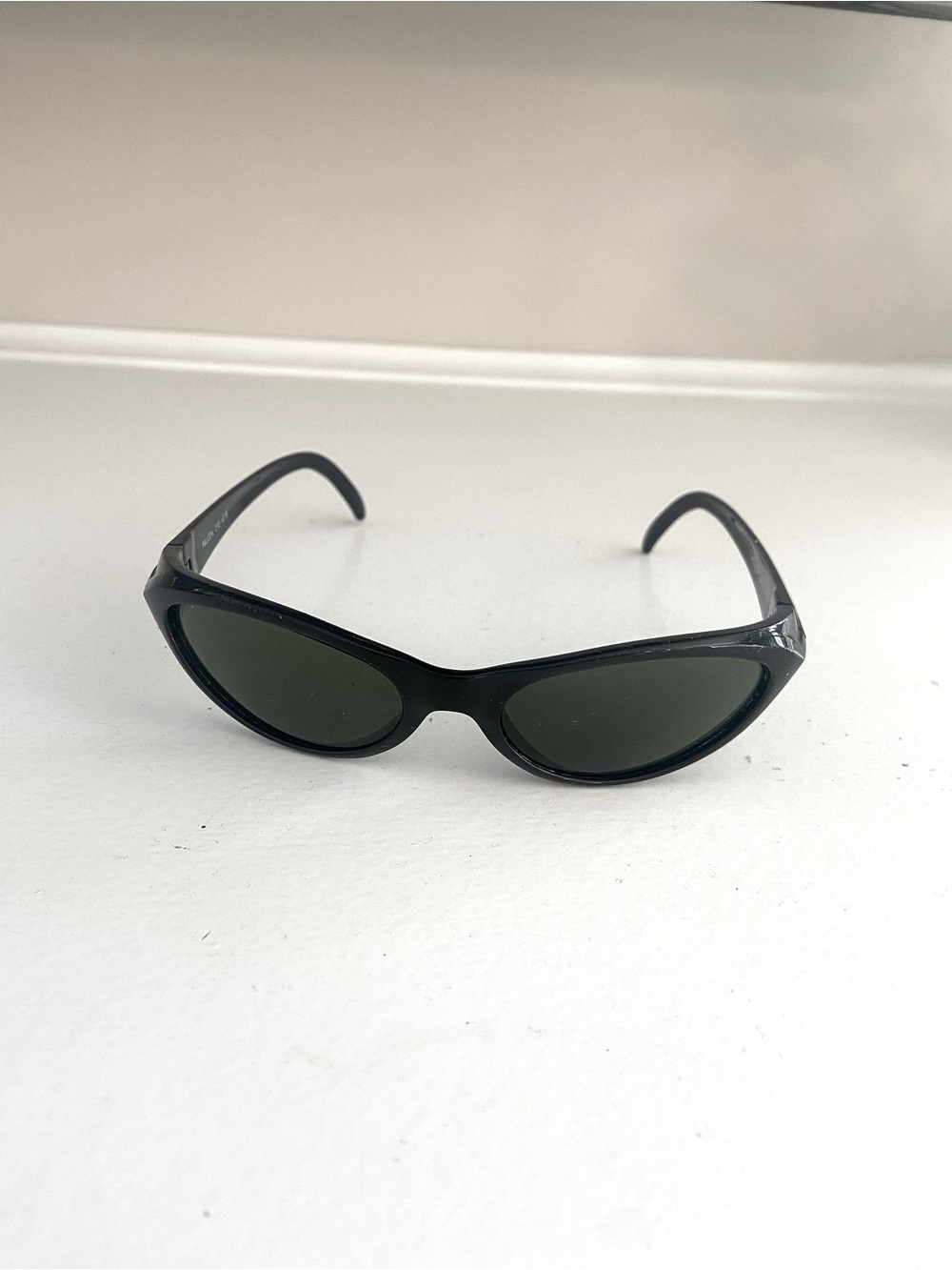 Arnette | Black Oval Cat-Eye Sunglasses with Dark Green Lenses